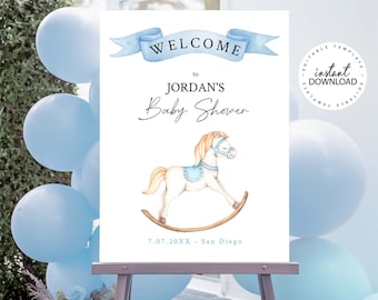 May include: A white welcome sign with blue ribbon and text that reads "Welcome to Jordan's Baby Shower 7.07.20XX - San Diego". A watercolor illustration of a rocking horse is in the center of the sign.