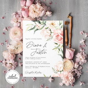 May include: Wedding invitation with a watercolor floral design featuring pink and white roses, green leaves, and the text "Diane & Justin" in black cursive font. The invitation includes the date, time, and location of the wedding ceremony. The text "Reception to follow" is also included.
