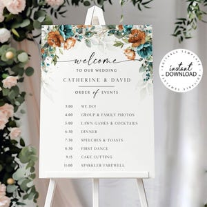 May include: A wedding sign on an easel, featuring the names "Catherine & David" and a schedule of events. The sign is decorated with teal and orange floral accents. The text reads "Welcome to our wedding".