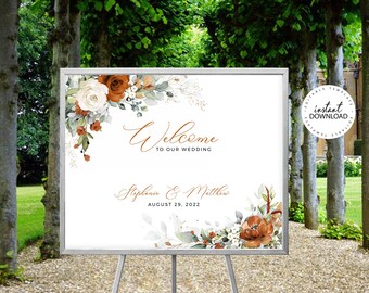 May include: A white wedding welcome sign on an easel, featuring floral arrangements in shades of rust, cream, and green. The sign reads "Welcome to our Wedding" with the couple's names and date. A circular "Instant Download" graphic is in the upper right corner.