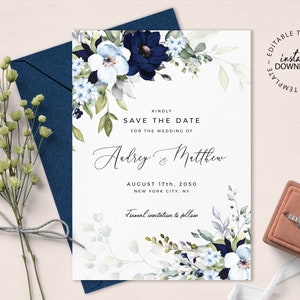 May include: A save the date card with a watercolor floral design in shades of blue and green. The text reads "Kindly Save the Date for the Wedding of Aubrey & Matthew August 17th, 2050 New York City, NY Formal invitation to follow"