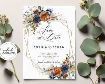May include: A white wedding invitation with floral accents in navy blue, rust, and green. The text reads "Save the Date" with the names Sophia and Ethan, and the date July 29, 2050. A gold geometric frame surrounds the text.