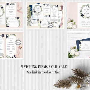 May include: A wedding invitation suite featuring a floral wreath design in shades of blue and green. The invitation includes a save the date card, a welcome card, a ceremony card, a reception card, and a details card. The cards are printed on white cardstock and feature a delicate floral pattern.