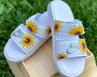 maroon nike slides with gold logo