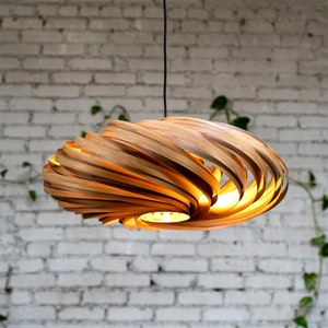 60 cm hanging lamp made of amber wood. Handcrafted wooden lamp from a Cologne studio.
