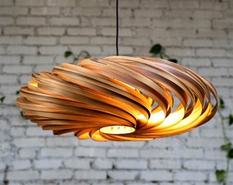 Large hanging lamp made of amber tree wood. Handmade wooden lamp from Cologne studio.