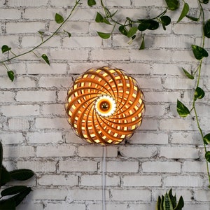 Designer wall light made of cherry wood 50 cm. Handcrafted wooden lamp from a Cologne studio.