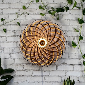 Designer wall lamp made of walnut 70 cm. Handcrafted wooden lamp from a Cologne studio.