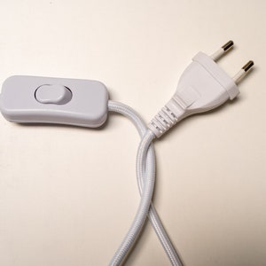 May include: White electrical cord with an inline on/off switch and a standard two-prong plug.