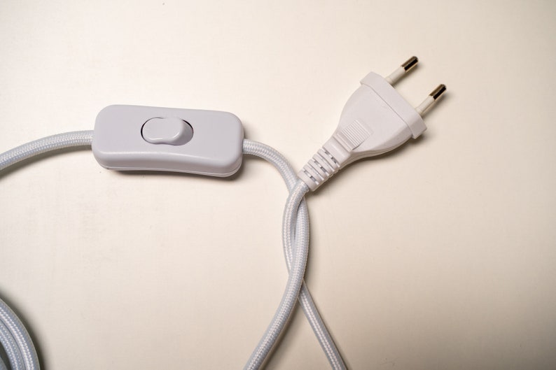 May include: White electrical cord with an inline on/off switch and a standard two-prong plug.