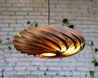 Large hanging lamp made of walnut wood. Handmade wooden lamp from Cologne studio.