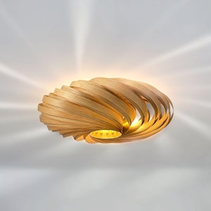 Ceiling light made of oak wood. Handcrafted wooden lamp from a Cologne studio.