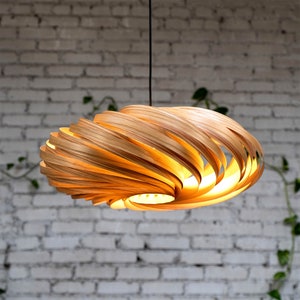Hanging lamp made of olive ash in 60 cm. Handcrafted wooden lamp from a Cologne studio.