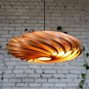 Hanging lamp made of cherry wood with a diameter of 70 cm. Handmade pendant lamp from a Cologne studio.
