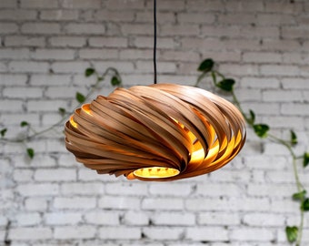 Large hanging lamp made of amber tree wood. Handmade wooden lamp from Cologne studio.