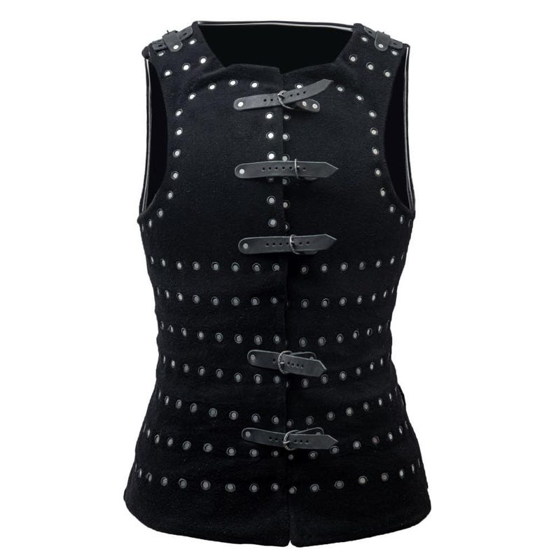 May include: Black sleeveless vest with multiple rows of silver eyelets and black leather straps with buckles.