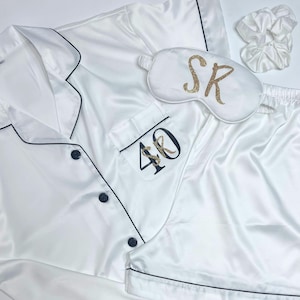 White milestone birthday pyjamas printed for a 40th birthday with both age and name on the pocket complete with matching sleep mask and scrunchie, a truly beautiful luxury set.