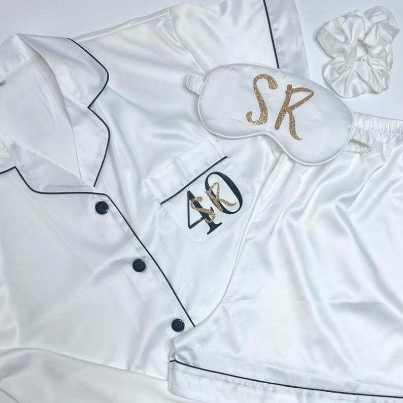 White milestone birthday pyjamas printed for a 40th birthday with both age and name on the pocket complete with matching sleep mask and scrunchie, a truly beautiful luxury set.