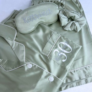 Sage Green coloured milestone birthday pyjamas printed for a 30th birthday with both age and name on the pocket complete with matching sleep mask and scrunchie, a truly beautiful luxury set.