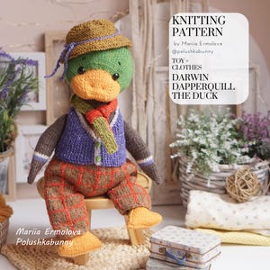 May include: A knitted toy duck wearing a hat, vest, scarf, and plaid pants. The duck is sitting on a small wooden stool. The text on the image reads "KNITTING PATTERN" and "DARWIN DAPPERQUILL THE DUCK".