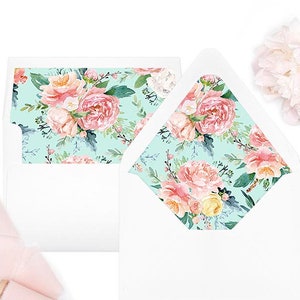 May include: Two white envelopes with a floral pattern on the flap. The pattern features pink, yellow, and white flowers on a light blue background. The text "ON MY LIST PAPETERIE" is printed at the bottom of the image.