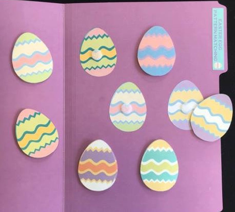 May include: A set of eight colorful Easter egg-shaped pieces with different patterns for a pattern matching game. The game is labeled "Easter Egg Pattern Matching".