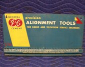 Vintage MCM GC General Cement wall sign advertising dealer sales service tube radio TV electronics alignment tool display for engineers