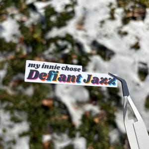 my innie chose defiant jazz: severance sticker or magnet