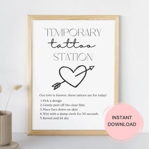 May include: A printable sign for a temporary tattoo station with a heart and arrow design. The sign says "Temporary tattoo station" and includes instructions for applying the tattoos. The sign also says "Our love is forever, these tattoos are for today!" and "Instant Download".