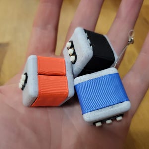 The Micro Crunch - Fidget-sleutelhanger met 2-traps voelbare knoppen