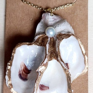 Large oyster shell necklace with a pearl