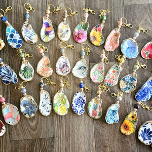 Decoupaged oyster shell keychain