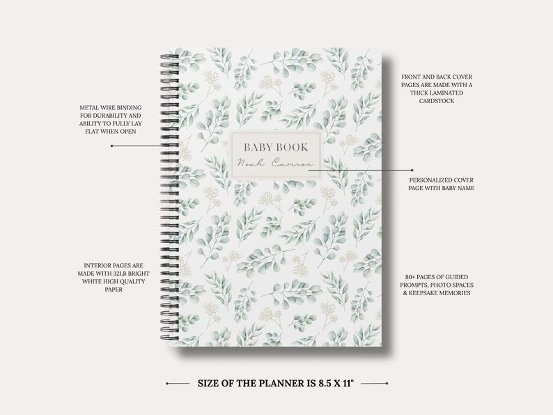 May include: A spiral-bound baby book measuring 8.5 x 11 inches with a white cover featuring a green eucalyptus leaf pattern. The cover includes a central label with the text BABY BOOK and a personalized name. Features include metal wire binding, thick laminated cardstock covers, 80+ pages of guided prompts, photo spaces, and 32lb bright white high-quality paper.