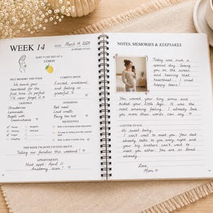 May include: A spiral-bound pregnancy journal open to week 14, featuring printed sections for cravings, milestones, and notes. The page includes a photo of a pregnant person, handwritten entries, a lemon illustration, and text such as Week 14, March 14, 2024, and Notes, Memories & Keepsakes.