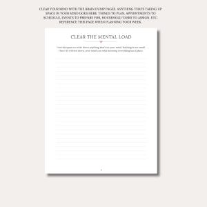 May include: A white planner page titled CLEAR THE MENTAL LOAD with a small heart icon. The text reads: Use this space to write down anything that's on your mind. Nothing is too small. Once it's written down, your mind can relax knowing everything has a place. It features horizontal lines for writing and the number 8 at the bottom.