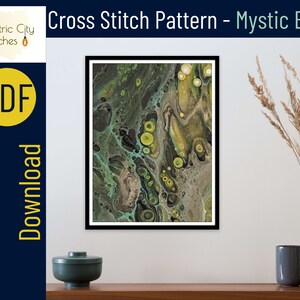 May include: A digital cross stitch pattern featuring an abstract design with swirling green, yellow, and black colors. The pattern is titled "Mystic Brew" and is available as an instant PDF download.