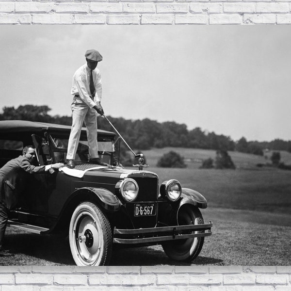 Golfing on a Car Poster Print, 1924 Man hitting Golf Ball off Old Antique Model T Car, Black and White Photograph Wall Art Home Decor