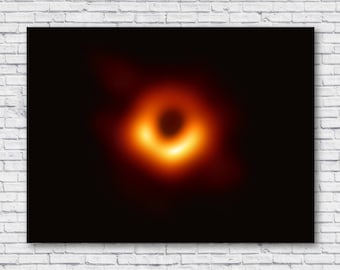 May include: A black and white image of a black hole, a region of spacetime where gravity is so strong that nothing, not even light, can escape. The black hole is surrounded by a bright ring of light, which is caused by the accretion of matter onto the black hole.