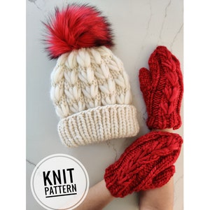 May include: A white knit beanie with a red pom pom and a pair of red knit fingerless gloves. The gloves have a cable knit pattern. The beanie and gloves are both handmade.