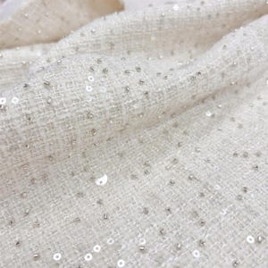 Glittrande pärlbesatt tweed-bouclétyg, elfenbensfärgat paljett-tweedtyg för kostymrock, 137 cm brett
