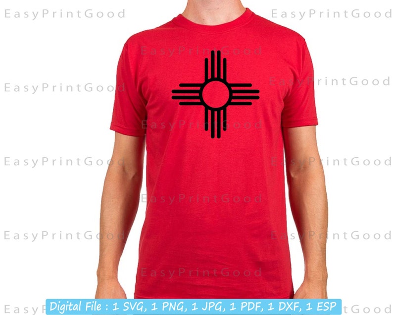 May include: A red t-shirt with a black graphic of the Zia symbol, a traditional symbol of the Pueblo people of New Mexico.
