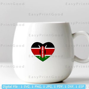 May include: White ceramic mug with a heart-shaped design featuring the flag of Kenya. The heart is red, black, and green with a shield in the centre.