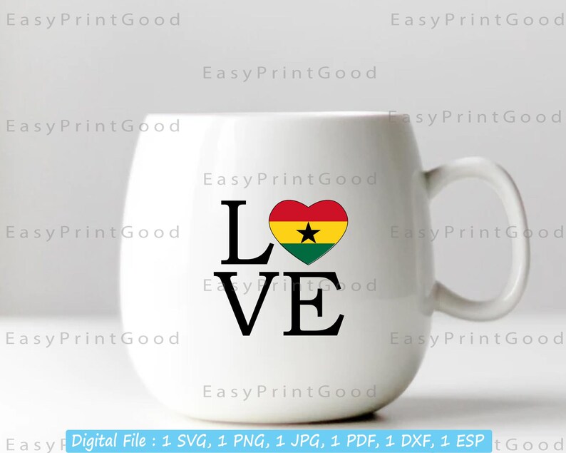 May include: White coffee mug with a black "LOVE" graphic and a red, yellow, green, and black heart with a black star in the center. The heart represents the flag of Ghana.
