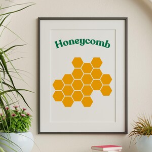 May include: A framed print with a yellow honeycomb design and the word "Honeycomb" in green text.