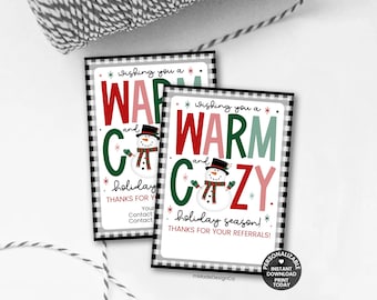 May include: Two holiday-themed cards with a black and white checkered border. The cards read "Wishing you a Warm and Cozy holiday season!" with a snowman graphic. The text is in red, green, and pink.