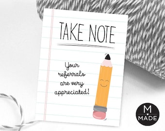May include: A white card with red lines and the text "TAKE NOTE" in black. Below the text is a yellow pencil with a smiling face and the text "Your referrals are very appreciated!" in black.
