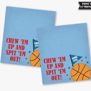 May include: Two blue and white printable treat bag toppers with a basketball and the text "Chew 'em up and spit 'em out!" and a small flag that says "Good Luck".