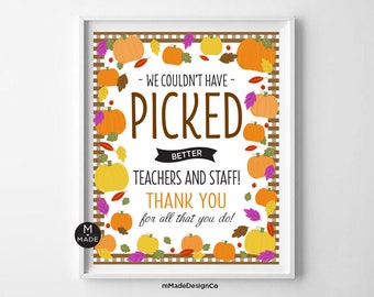 May include: Framed print with a white border. The print features the text "WE COULDN'T HAVE PICKED BETTER TEACHERS AND STAFF! THANK YOU for all that you do!" surrounded by orange, yellow, and purple pumpkins and leaves.