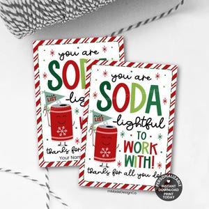 May include: Two rectangular gift tags with a red and white striped border. The tags read "You are SODA-lightful to work with!" and feature a cartoon soda can with a snowflake and a "nice list" flag. The tags are for personalization.