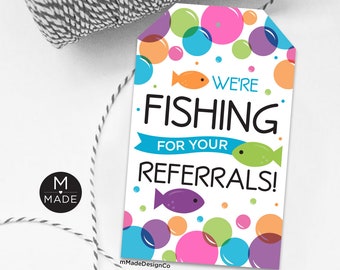 May include: A white tag with colorful bubbles and fish. The text on the tag reads "We're Fishing for Your Referrals!"